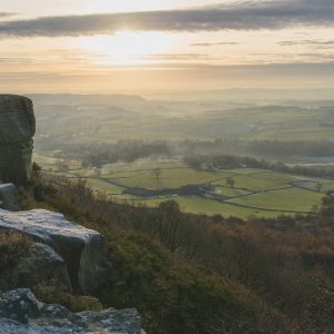 Baslow Edge Sunrise Fine Art Print featuring soft morning light over the rolling Derbyshire countryside.