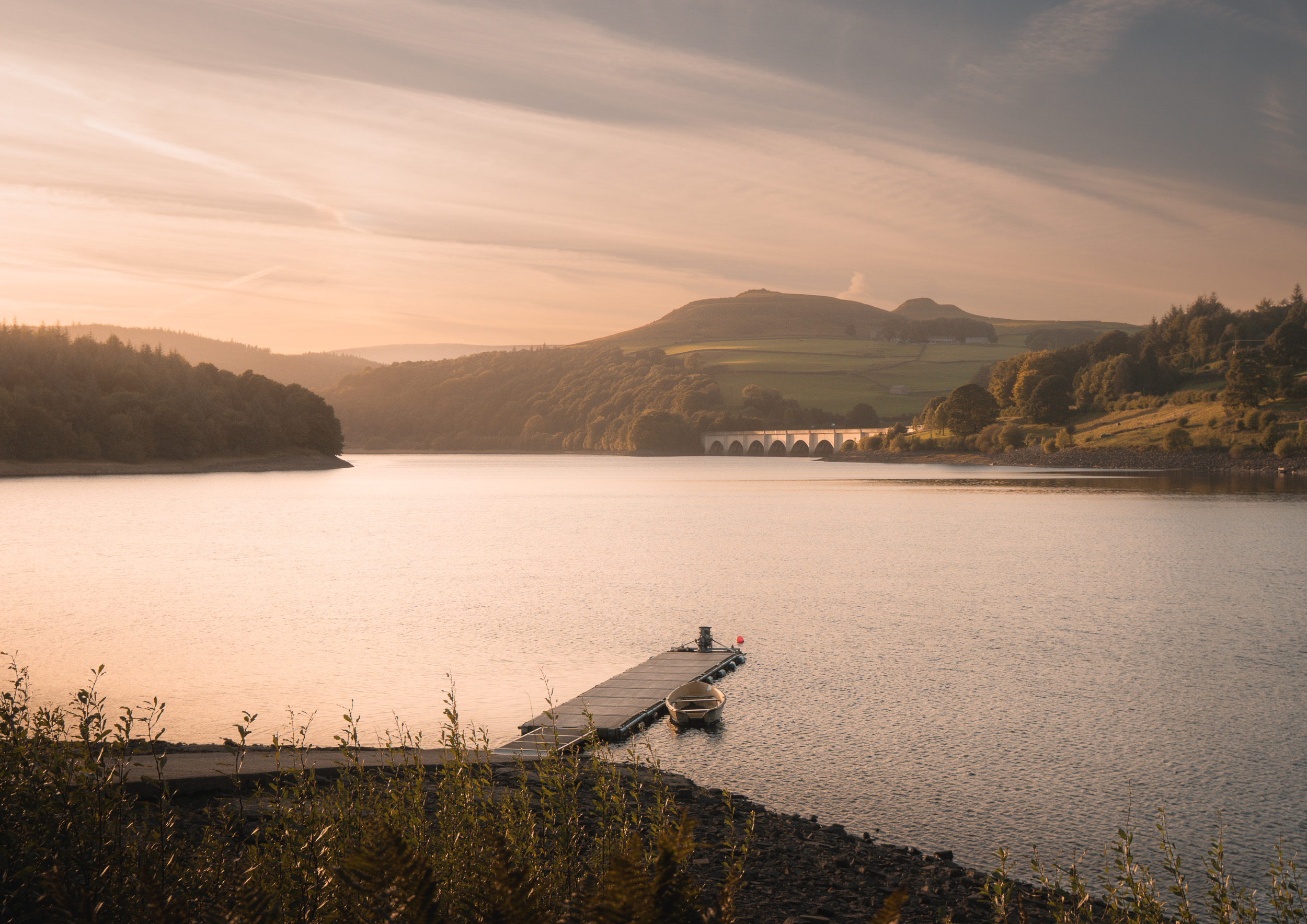 Ladybower Jetty Fine Art Print, showing this popular location in a hazy golden glow