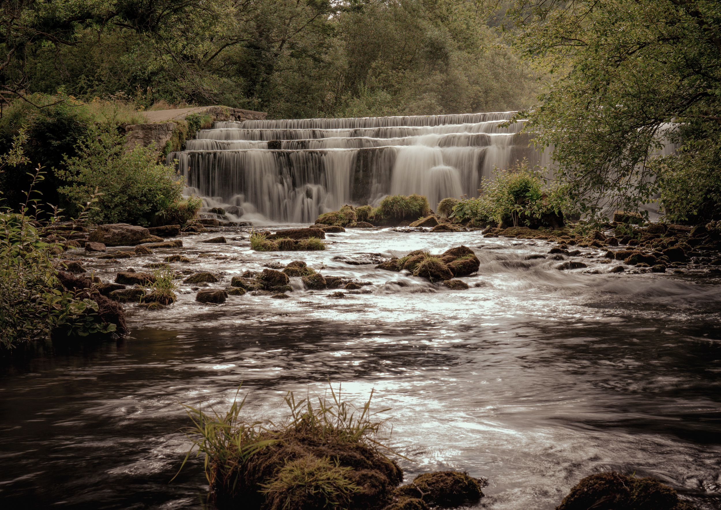 Monsal Dale Waterfall Print showing the calming cascades